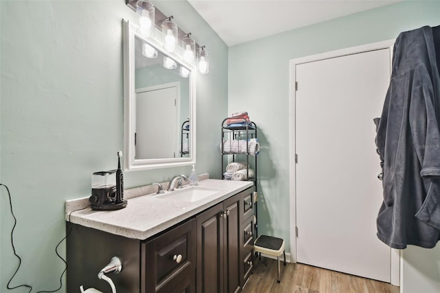 bathroom featuring vanity and wood-type flooring