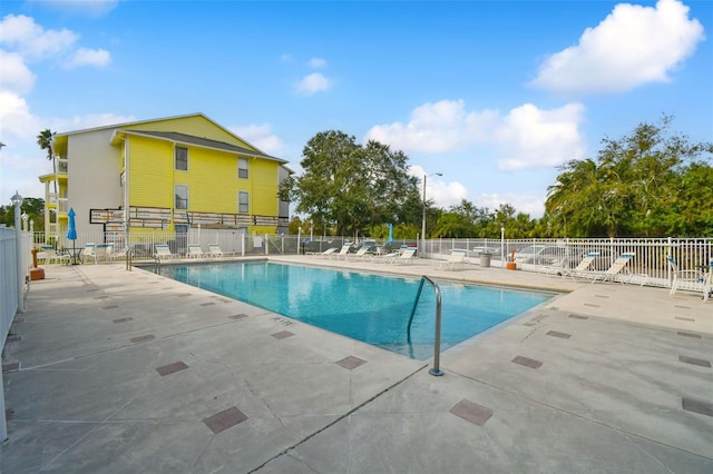 view of swimming pool with a patio area