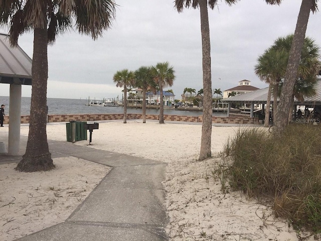 view of property's community with a water view and a gazebo