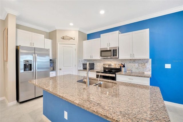 kitchen featuring light stone countertops, crown molding, appliances with stainless steel finishes, and white cabinets