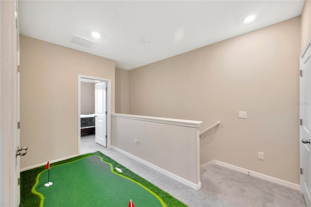 game room featuring light carpet