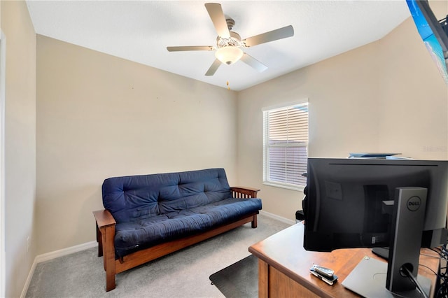 carpeted home office with ceiling fan