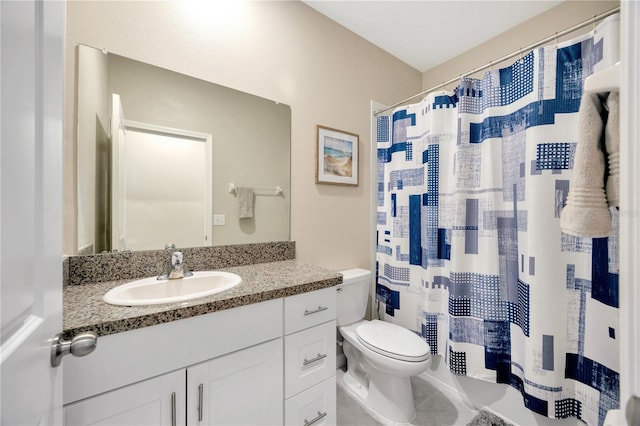 bathroom with vanity, a shower with shower curtain, toilet, and tile patterned flooring