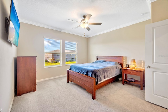 bedroom with crown molding, light colored carpet, a textured ceiling, and ceiling fan