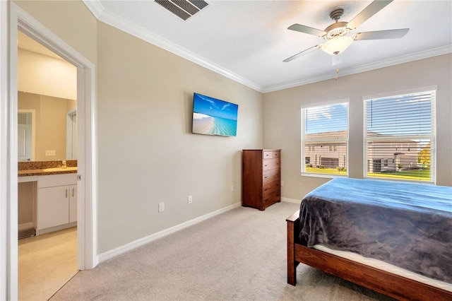 bedroom with ornamental molding, light carpet, ensuite bathroom, and ceiling fan