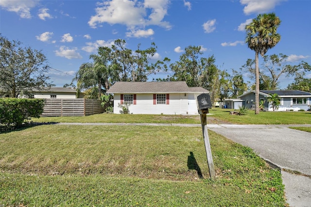 ranch-style house with a front lawn