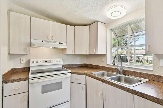 kitchen featuring white electric range, a textured ceiling, and sink