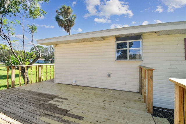 deck featuring a lawn