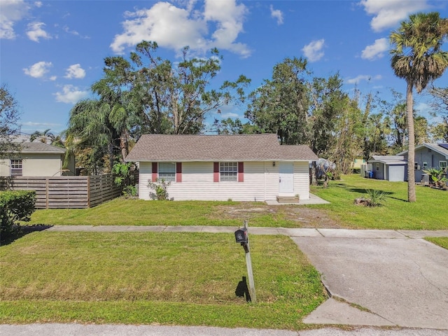 single story home featuring a front lawn