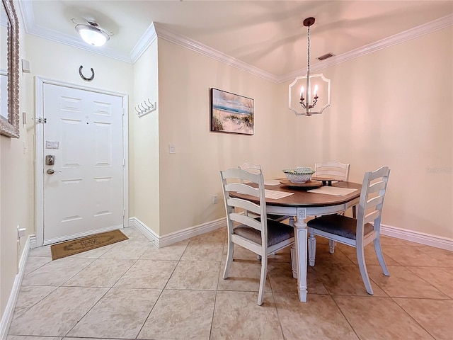 dining area with an inviting chandelier, crown molding, and light tile patterned floors