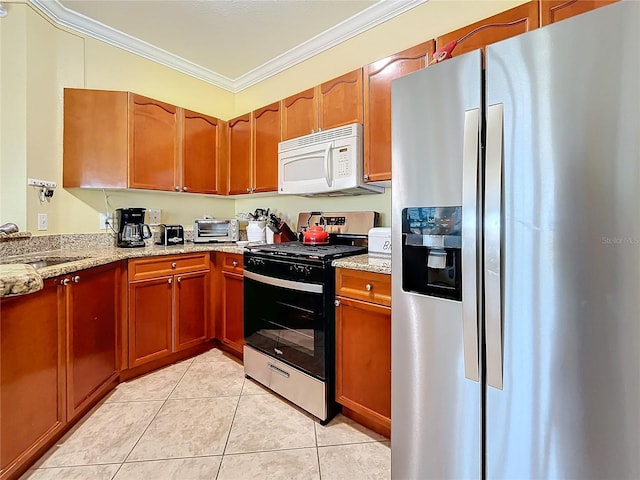 kitchen featuring light tile patterned floors, light stone countertops, sink, crown molding, and stainless steel appliances