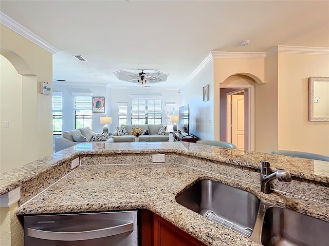 kitchen with crown molding, sink, and ceiling fan