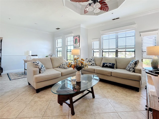 living room with crown molding, light tile patterned floors, and ceiling fan