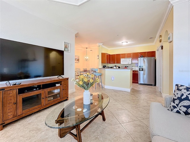 living room with ornamental molding and light tile patterned floors