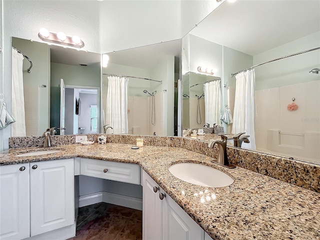 bathroom featuring vanity and a shower with curtain