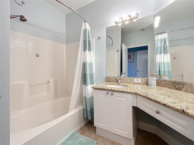 bathroom with vanity, shower / tub combo with curtain, and tile patterned floors