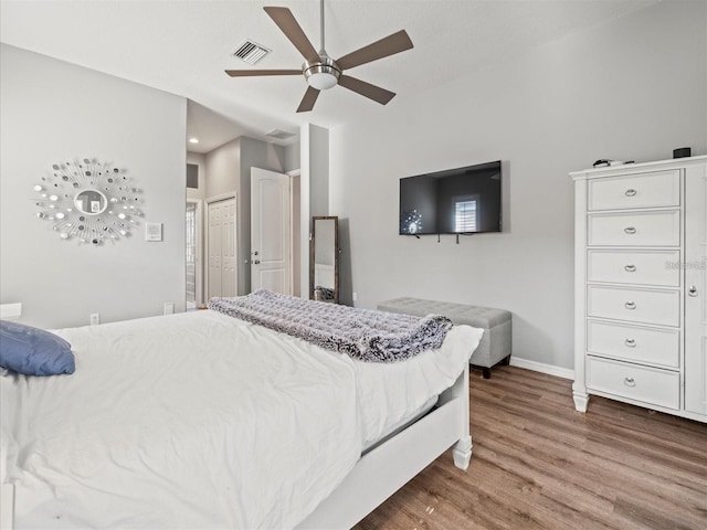 bedroom featuring wood-type flooring and ceiling fan