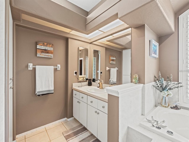 bathroom with vanity, tile patterned floors, and a bathtub