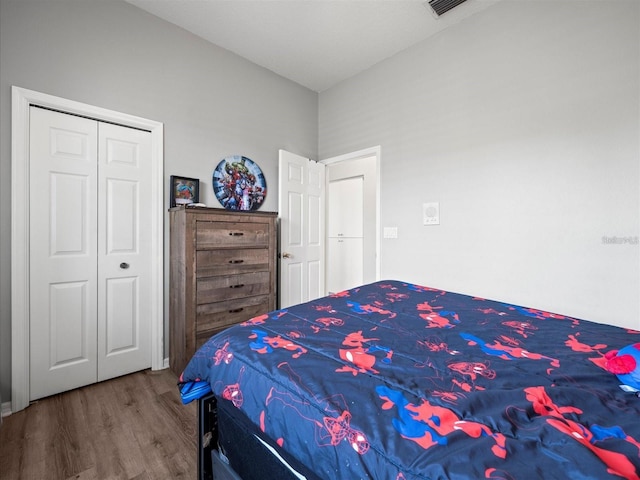 bedroom featuring hardwood / wood-style flooring and a closet