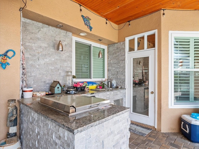 view of patio with an outdoor bar and an outdoor kitchen