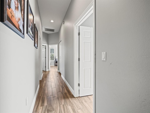 corridor featuring light hardwood / wood-style flooring