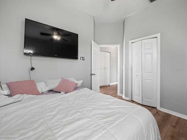 bedroom with hardwood / wood-style floors and a closet