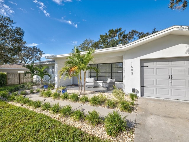 single story home featuring a garage