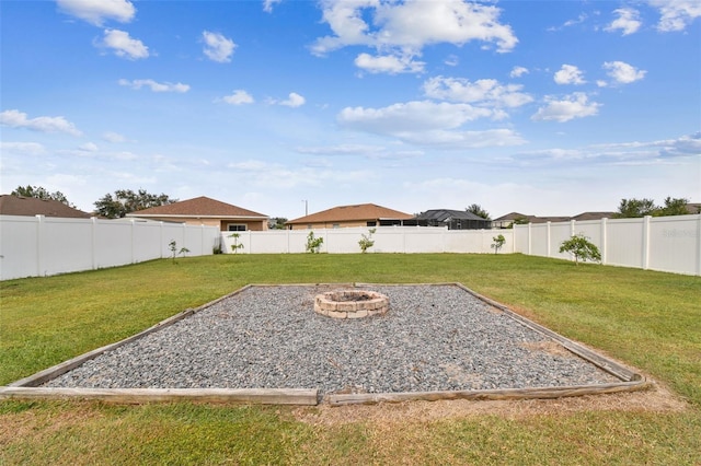 view of yard with an outdoor fire pit