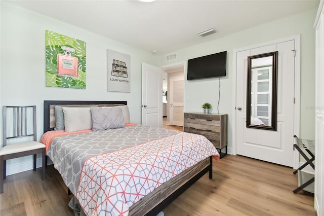 bedroom featuring wood-type flooring