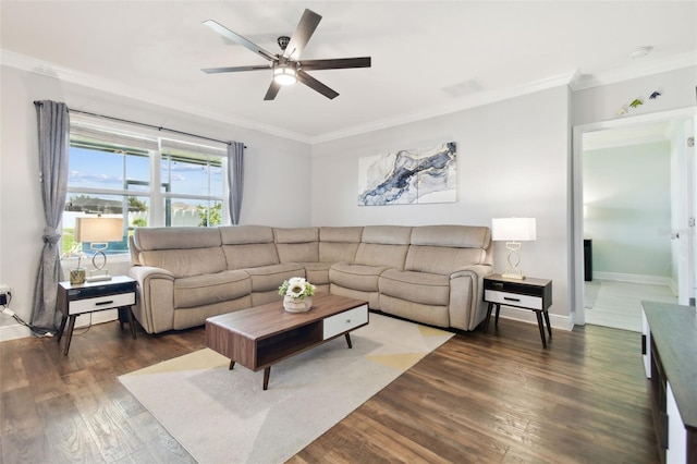 living room featuring crown molding, ceiling fan, and dark hardwood / wood-style floors