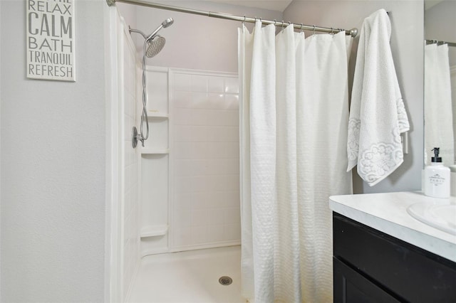 bathroom with vanity and a shower with shower curtain