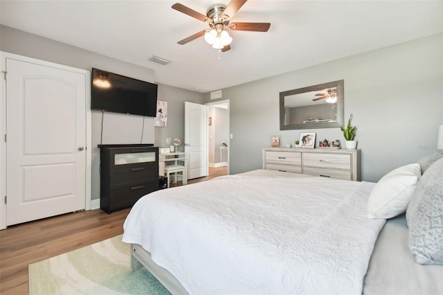 bedroom featuring ceiling fan and light wood-type flooring