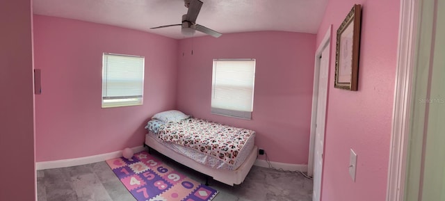 bedroom with light hardwood / wood-style flooring and ceiling fan