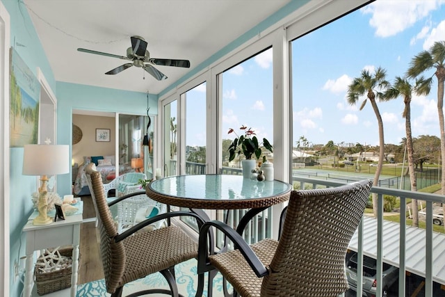 sunroom / solarium with ceiling fan