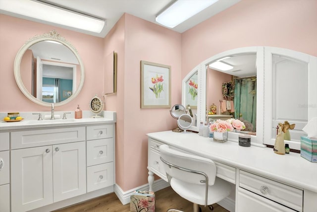 bathroom featuring vanity and hardwood / wood-style floors