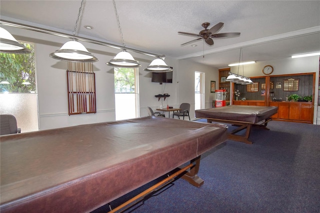 game room featuring pool table, a textured ceiling, carpet flooring, and ceiling fan