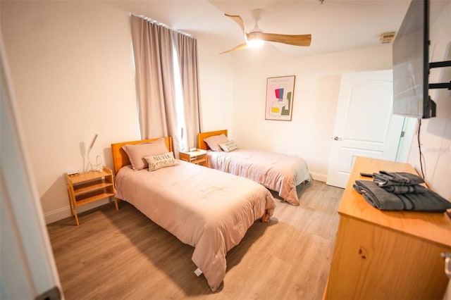 bedroom featuring ceiling fan and hardwood / wood-style floors