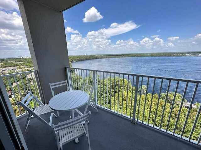 balcony featuring a water view