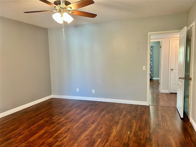 spare room featuring ceiling fan, a textured ceiling, and dark hardwood / wood-style flooring