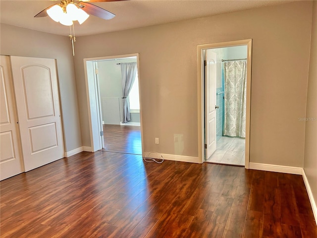 unfurnished room featuring dark hardwood / wood-style floors and ceiling fan