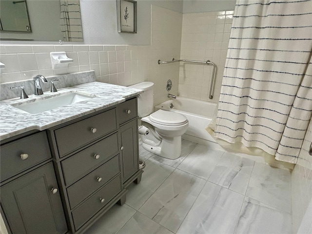 full bathroom with vanity, toilet, tile walls, and shower / bath combination with curtain