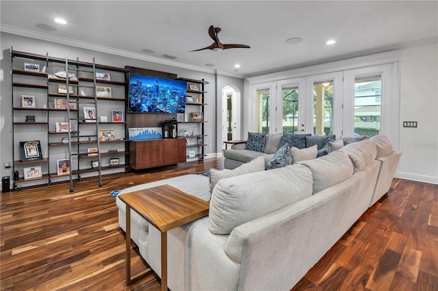 living room featuring ornamental molding, ceiling fan, dark hardwood / wood-style flooring, and french doors