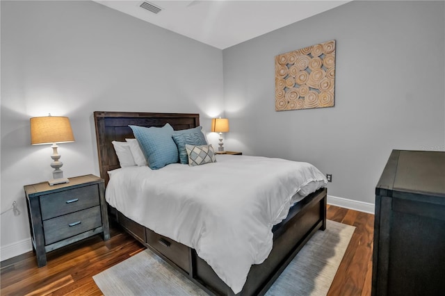 bedroom featuring dark hardwood / wood-style flooring