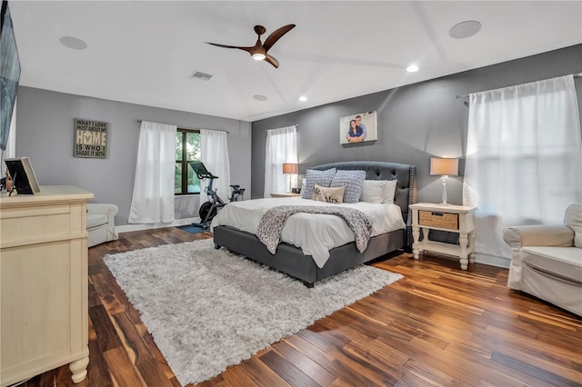 bedroom with ceiling fan and dark hardwood / wood-style flooring