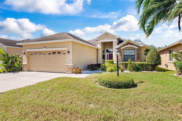 ranch-style home with a front yard and a garage