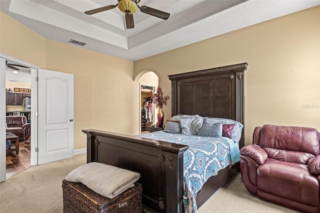 bedroom with light carpet and ceiling fan