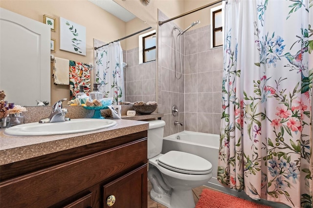 full bathroom featuring toilet, shower / tub combo with curtain, vanity, and tile patterned floors