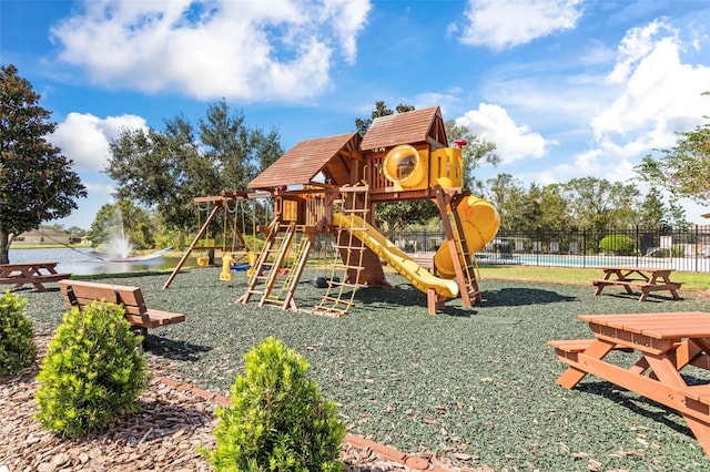 view of play area with a water view