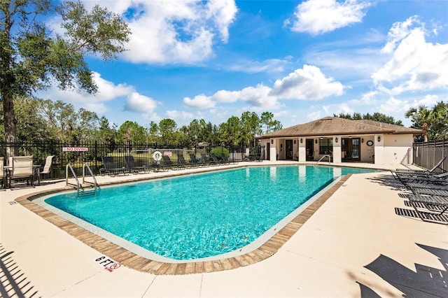 view of pool featuring a patio