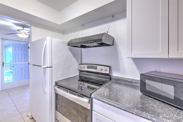 kitchen with light tile patterned flooring, electric range, ventilation hood, and white cabinets